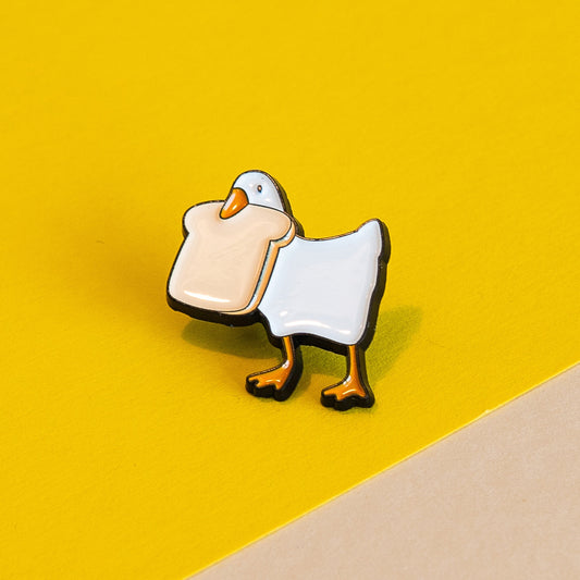 Toast-Thief Duck Enamel Pin - Charming Bread-Loving Duck Accessory for Casual Fun