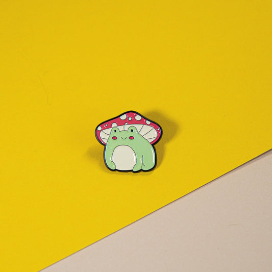Adorable Frog Enamel Pin with Mushroom Umbrella – Cute and Quirky Accessory for Bags, Clothing, and Collectibles